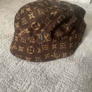 Louis Vuitton bucket hat.
